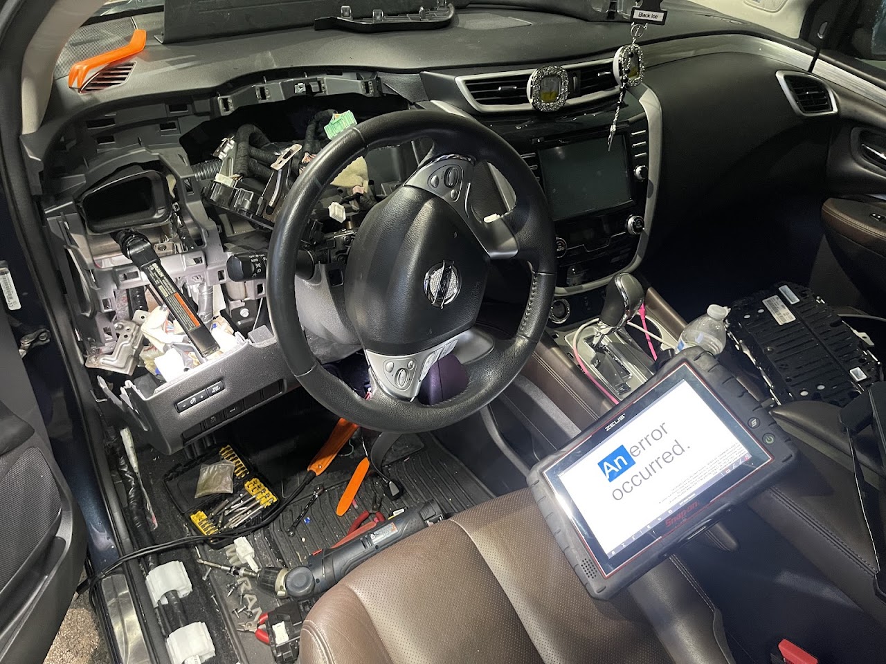 Meticulous wiring and fuse box repair work with precision multimeters